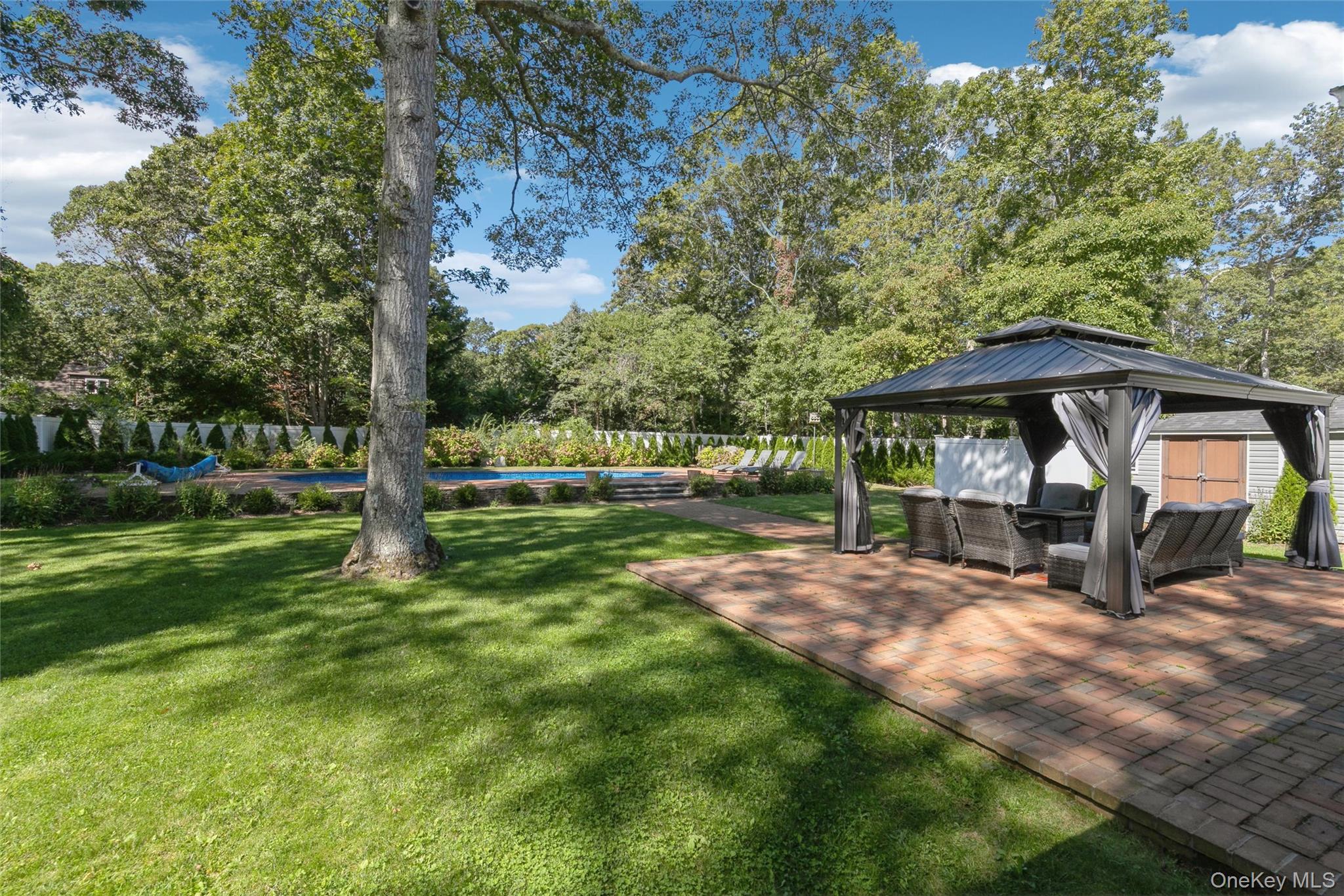 10 Rutland Road East Hampton, NY 11937 - Photo 28 of 47 a view of a house with backyard and sitting area