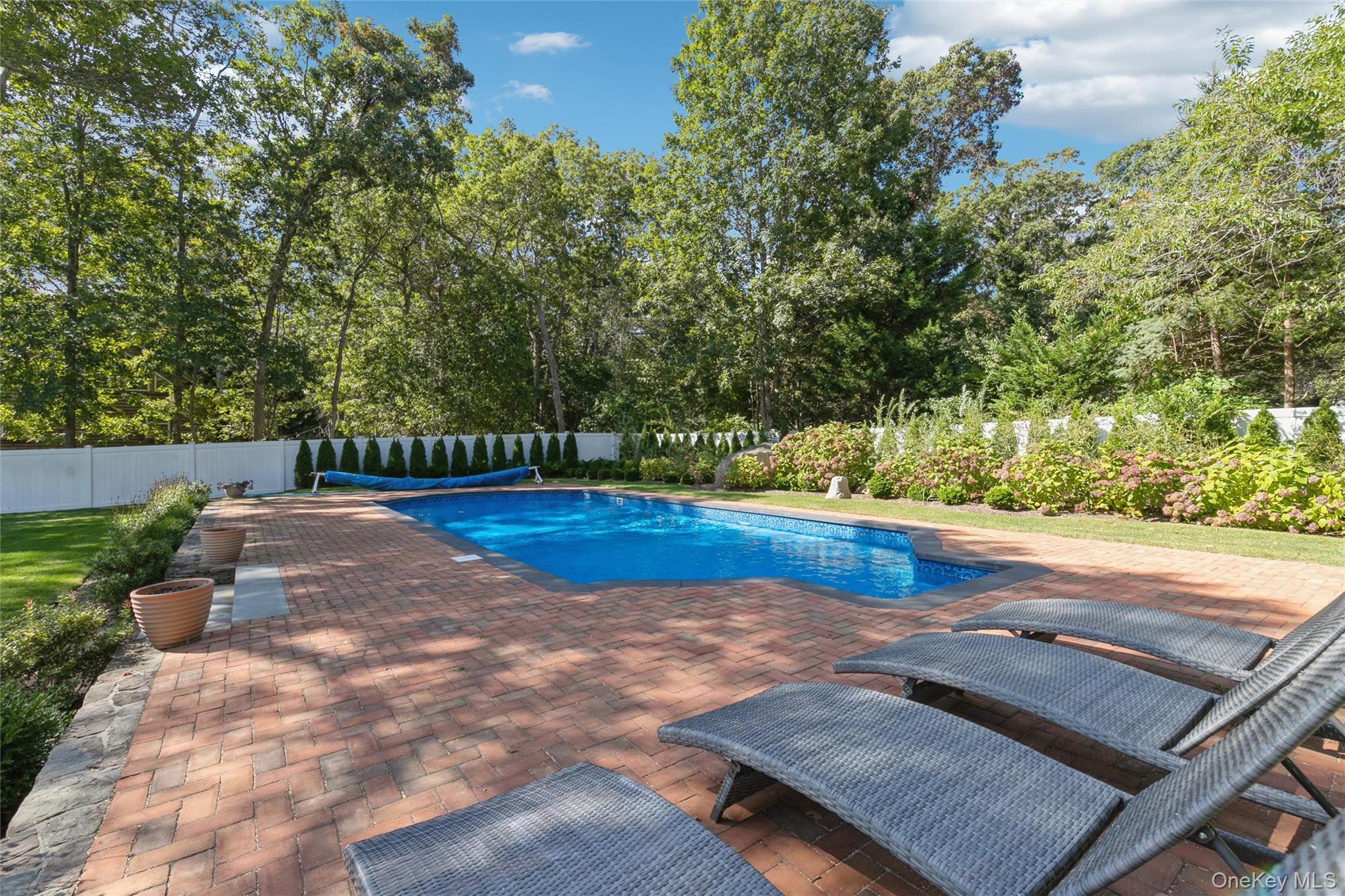 10 Rutland Road East Hampton, NY 11937 - Photo 32 of 47 a view of a backyard