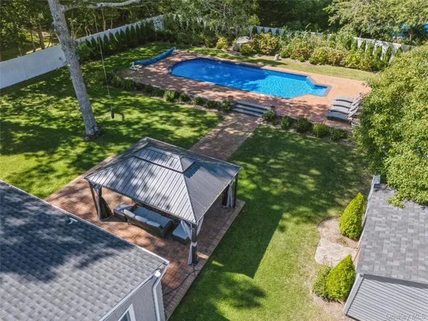 a view of a yard with an ocean view
