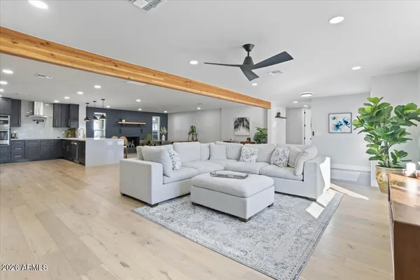 a living room with furniture and a large window
