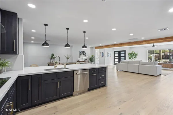 a spacious bathroom with a double vanity sink and a mirror