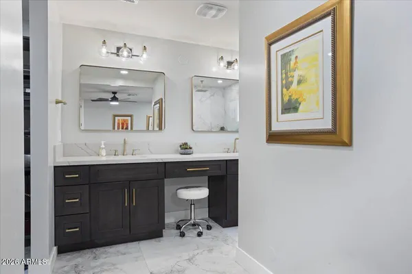 a bathroom with a sink a mirror and a toilet