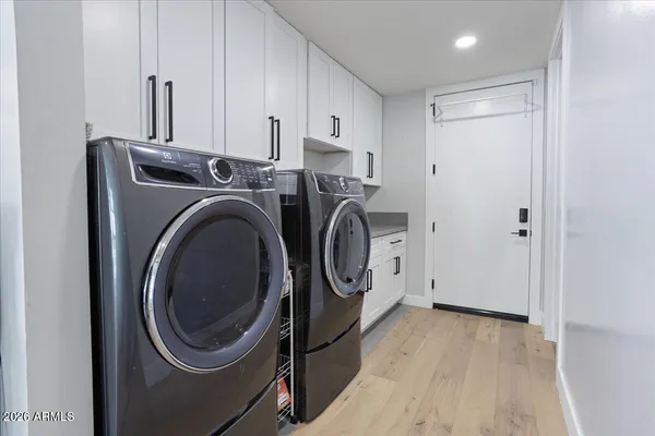 a view of a storage & utility room with washer and dryer