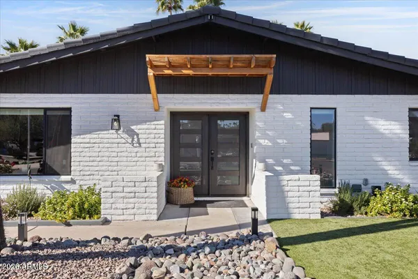 a front view of a house with garden