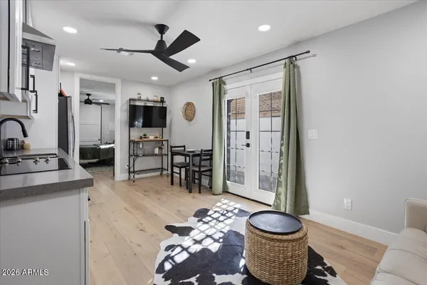 a living room with furniture and a potted plant