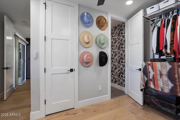 a view of walk in closet with clothes