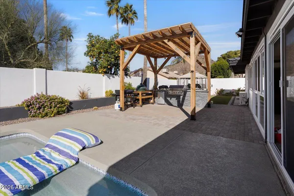 a view of a swimming pool with seating space