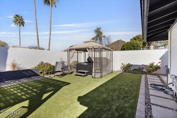 a view of a house with swimming pool and porch