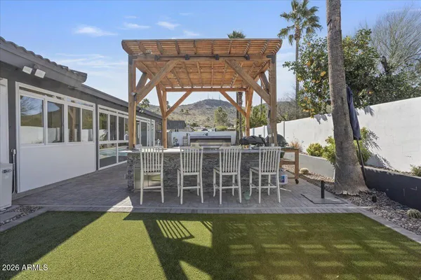 a view of a swimming pool with a patio