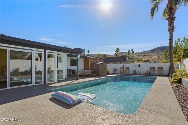 a view of a balcony with potted plants