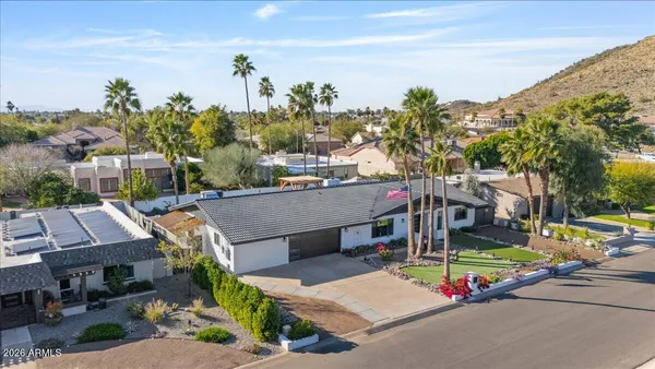a view of a house with outdoor space and swimming pool