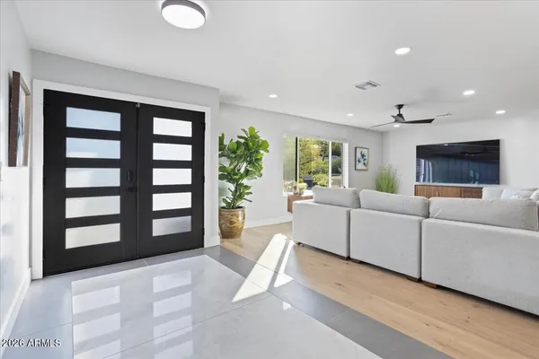 a living room with furniture and a large window