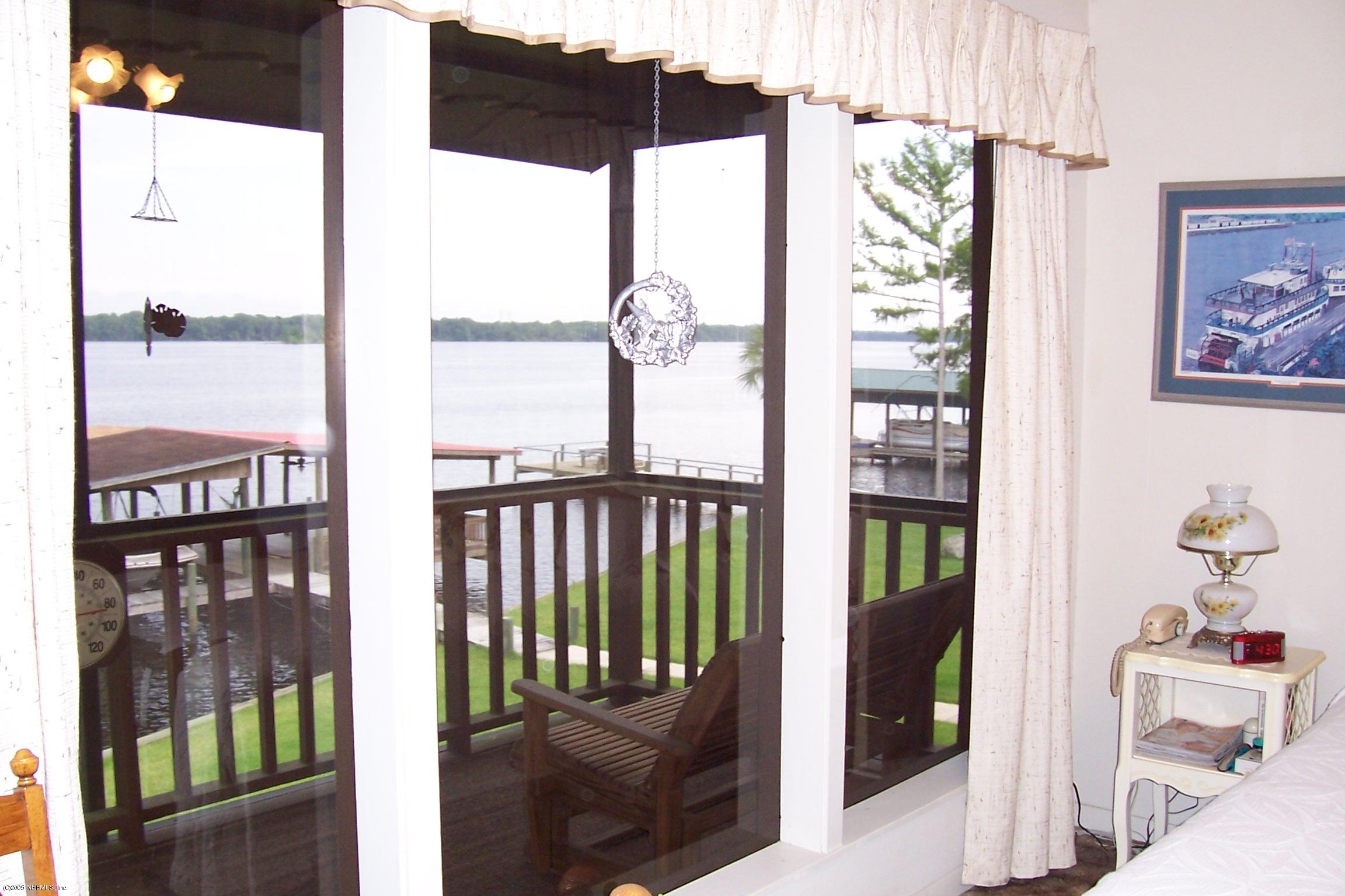 120 Riverside Drive Satsuma, FL 32189 - Photo 12 of 31 River thru screened porch master bedroom