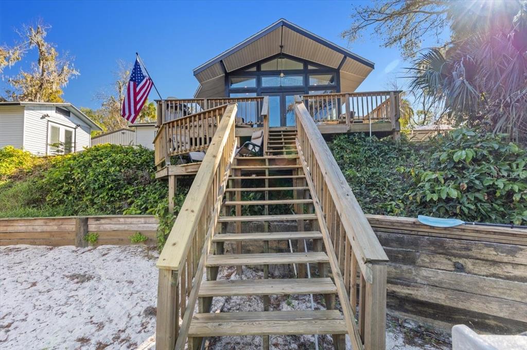 7226 Alafia Ridge Loop Riverview, FL 33569 - Photo 41 of 51 a view of a house with a small yard and wooden fence