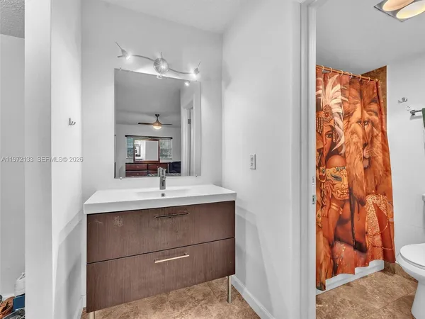 a bathroom with a sink and a mirror
