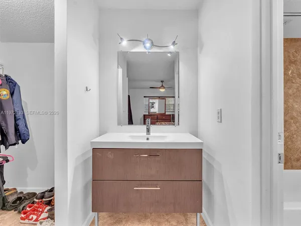 a bathroom with a sink and a mirror