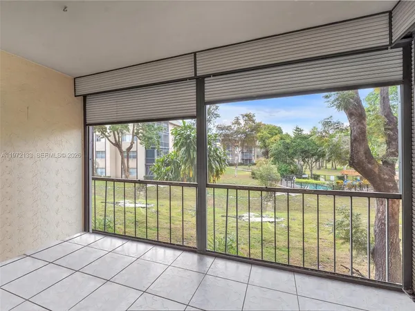 a view of a room with a large window