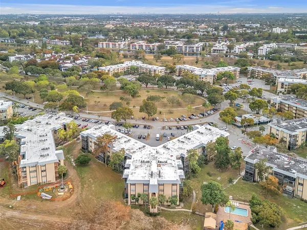 an aerial view of residential building with parking space