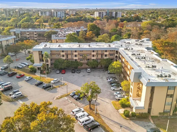 an aerial view of a swimming pool and mountain view