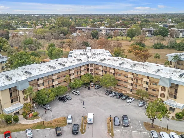 an aerial view of a house with a lake view