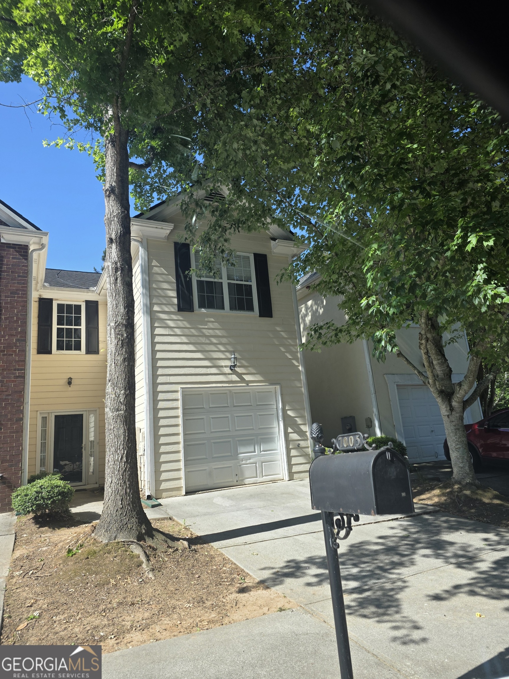 7005 Biltmore Trace Lithonia, GA 30058 - Photo 2 of 3 a front view of a house with garden