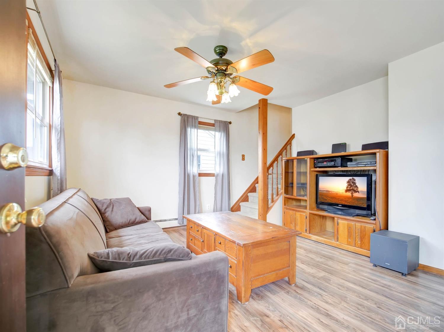 21 Crescent Road Edison, NJ 08817 - Photo 11 of 38 a living room with furniture and a flat screen tv