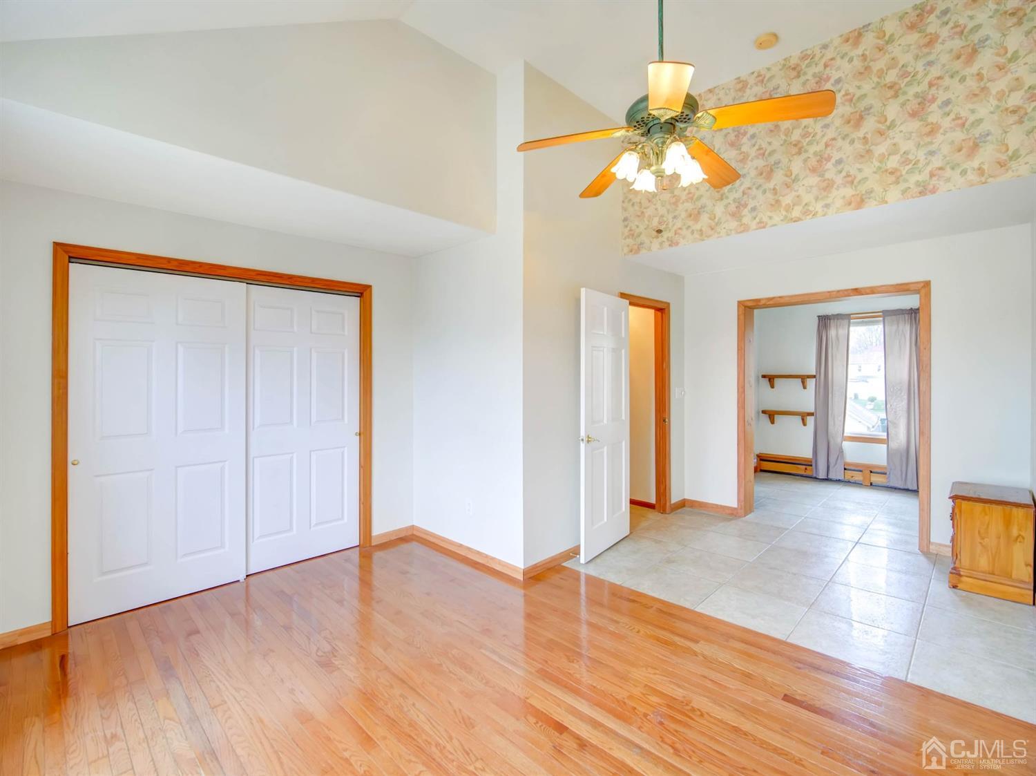 21 Crescent Road Edison, NJ 08817 - Photo 14 of 38 a view of an empty room with window and wooden floor
