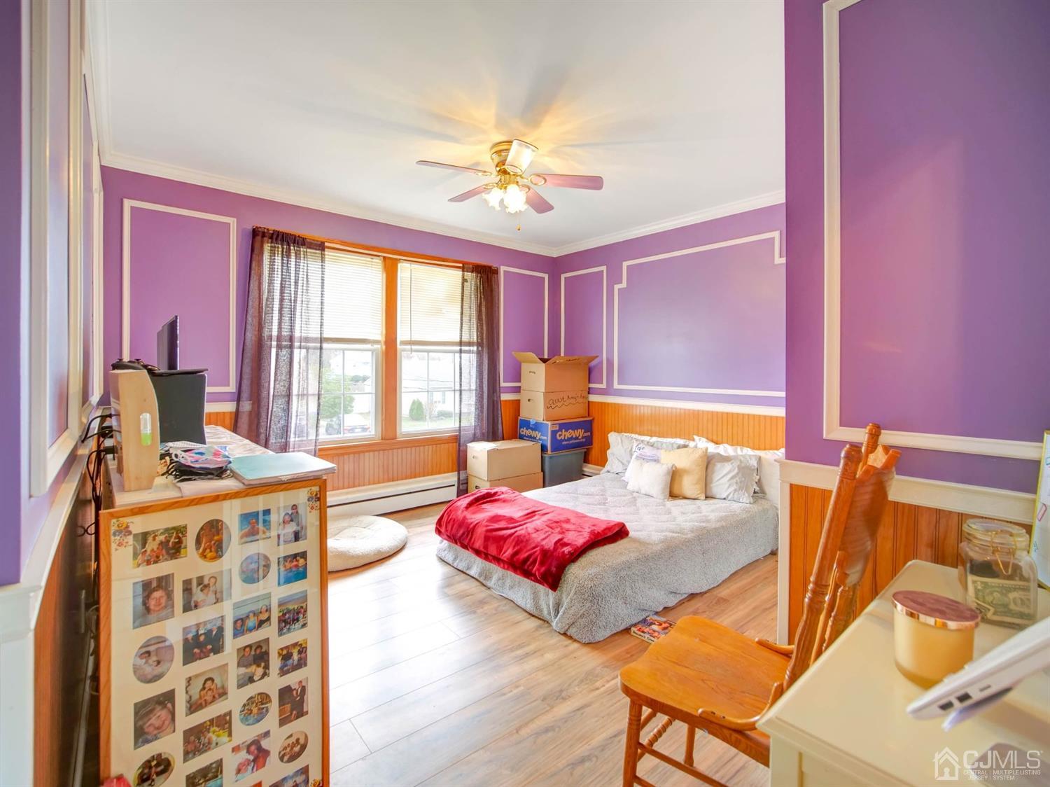 21 Crescent Road Edison, NJ 08817 - Photo 19 of 38 a bedroom with a bed and wooden floor