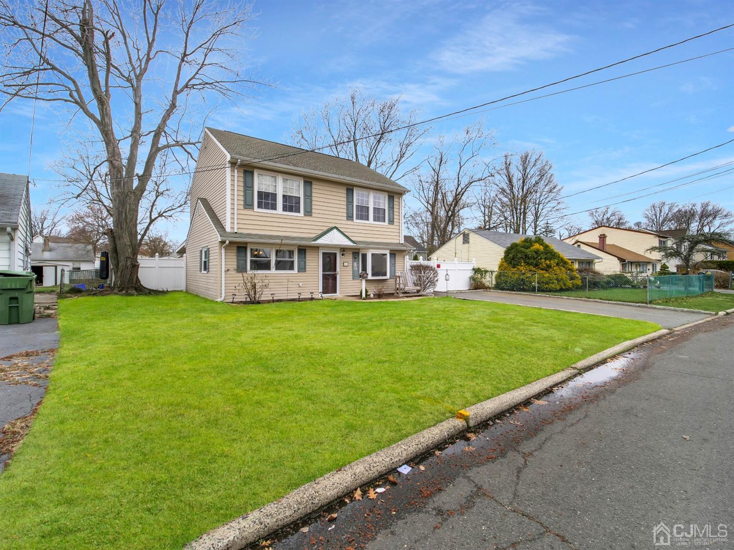 21 Crescent Road Edison, NJ 08817 - Photo 3 of 38 a front view of building with yard and green space