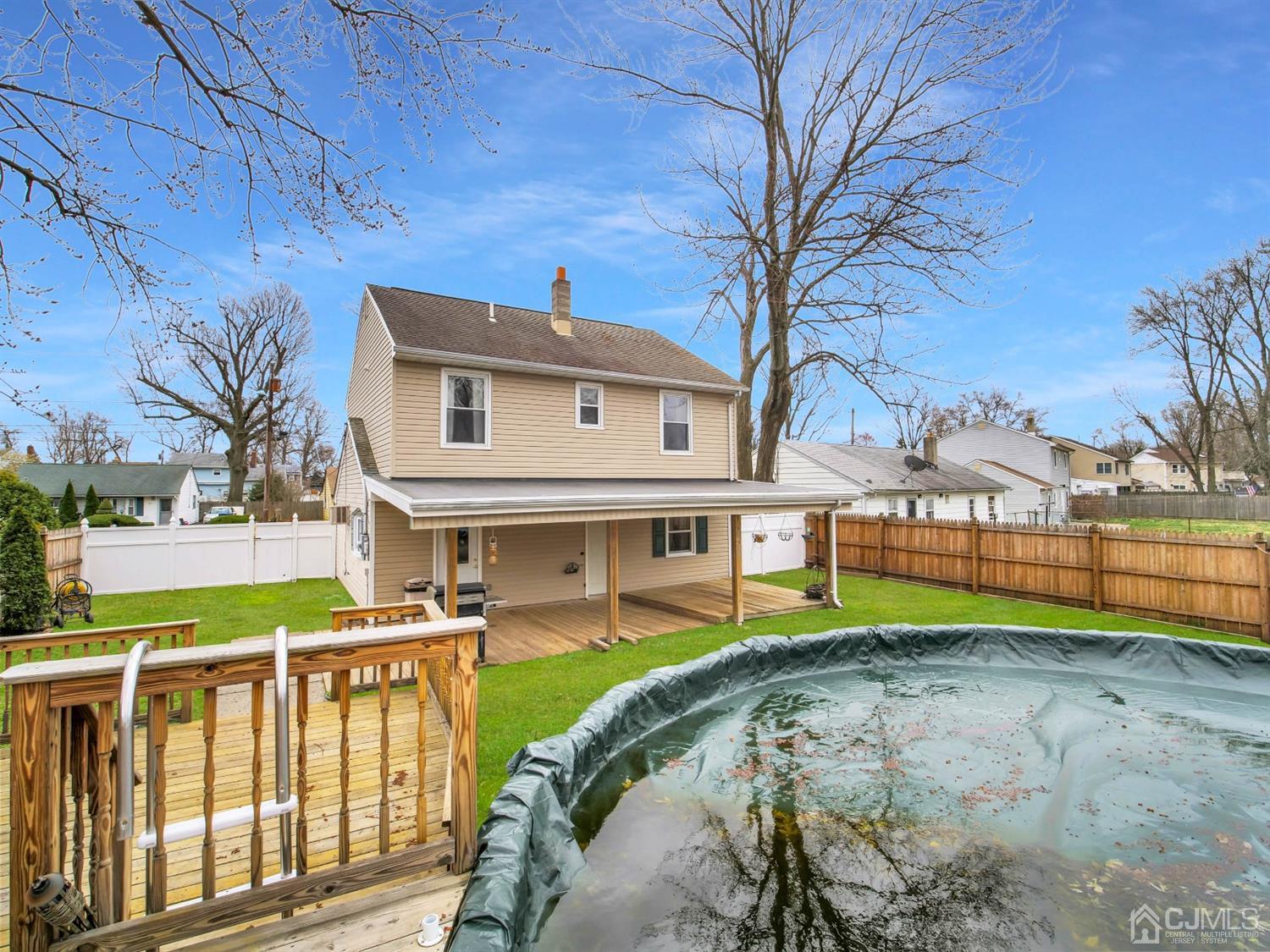 21 Crescent Road Edison, NJ 08817 - Photo 27 of 38 a front view of a house with a yard table and chairs