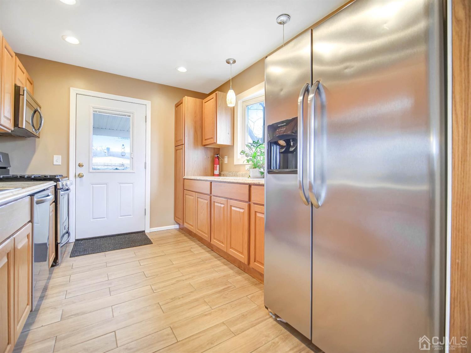 21 Crescent Road Edison, NJ 08817 - Photo 9 of 38 a kitchen with stainless steel appliances granite countertop a refrigerator and a sink