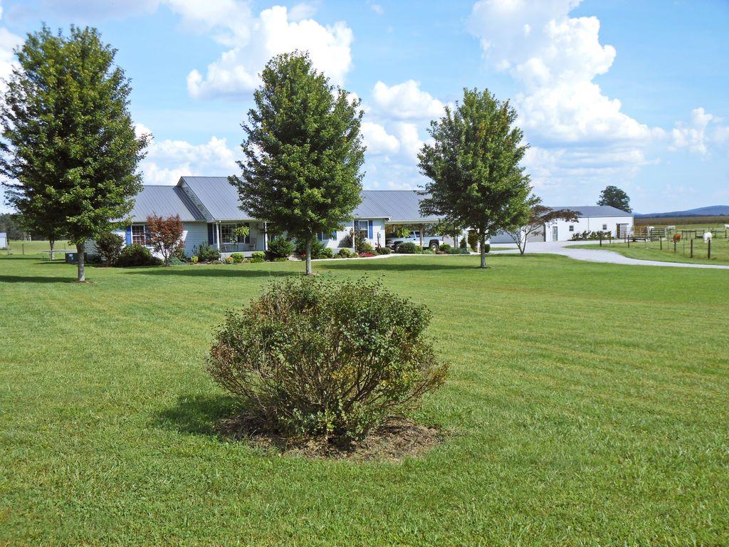 214 Hotel Road Flintville, TN 37335 - Photo 1 of 18 a view of a big yard with a house