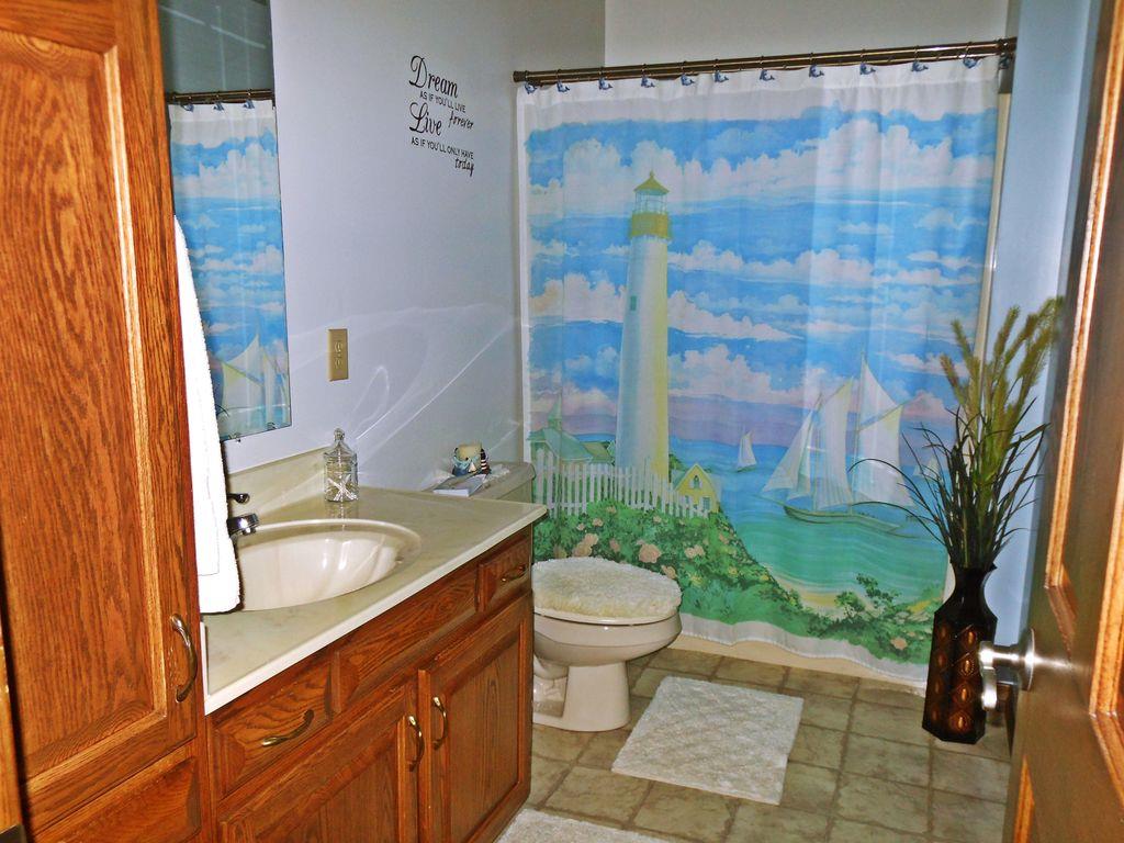 214 Hotel Road Flintville, TN 37335 - Photo 17 of 18 a spacious bathroom with a granite countertop sink a toilet a mirror a shower and a bathtub