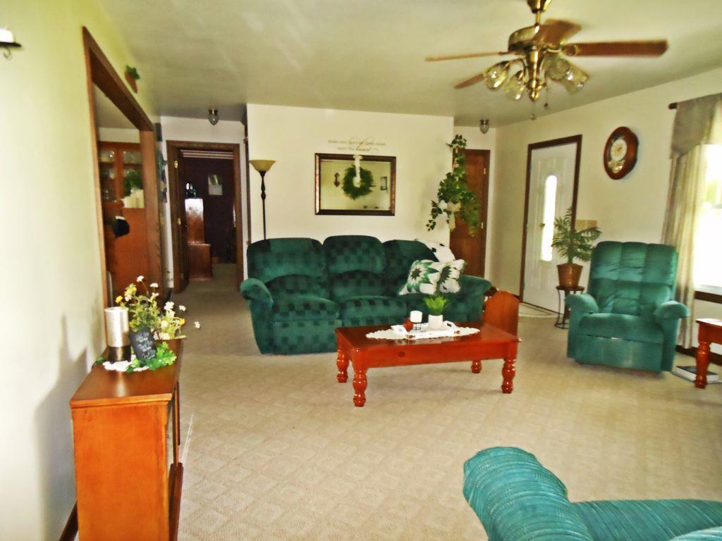 214 Hotel Road Flintville, TN 37335 - Photo 10 of 18 a living room with furniture and a chandelier