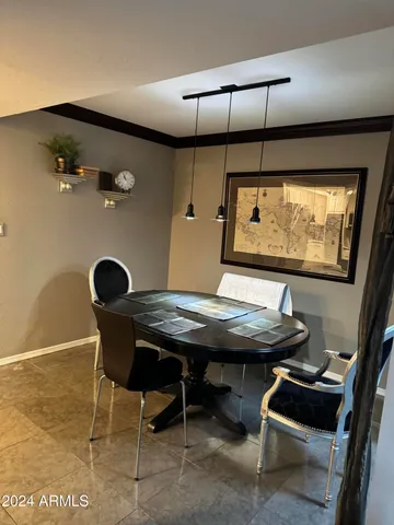 a view of a room with furniture and window