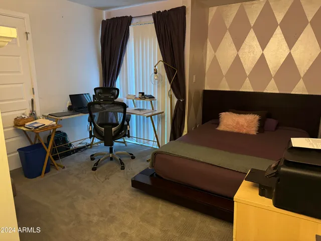 a room with furniture and a chair