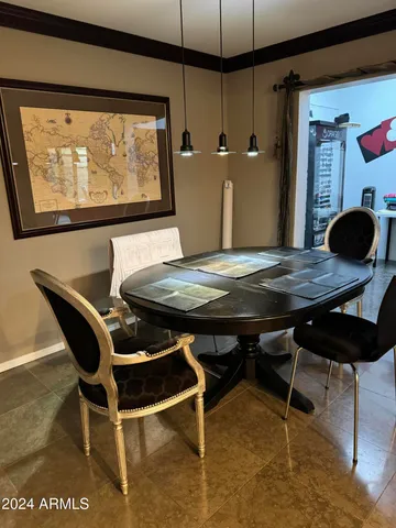 a view of a dining room with furniture and window