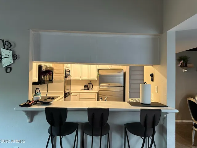 a dining room with a table and chairs