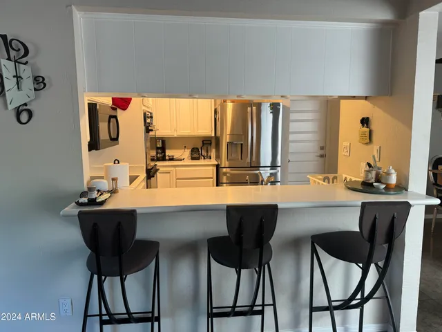 a dining room with table and chairs