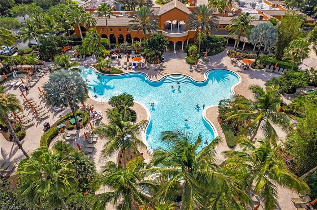 9108 Capistrano Street South, Unit 7401 Naples, FL 34113 - Photo 31 of 44 an aerial view of a swimming pool with outdoor seating