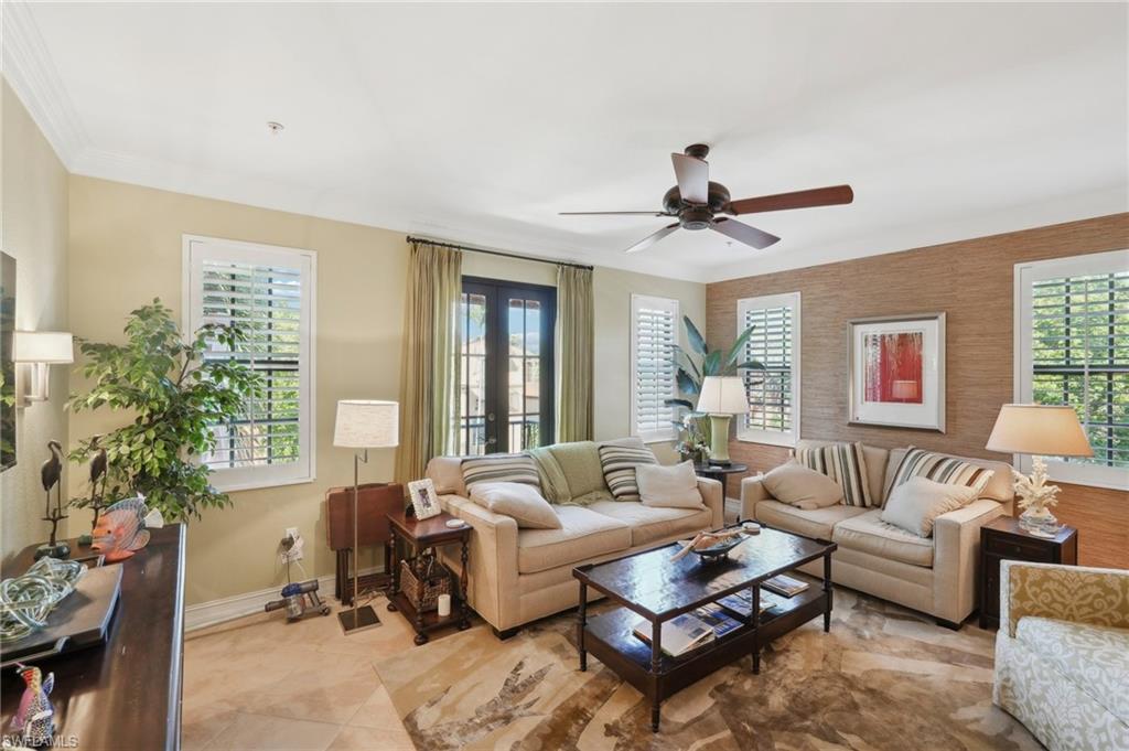 9108 Capistrano Street South, Unit 7401 Naples, FL 34113 - Photo 5 of 44 a living room with furniture