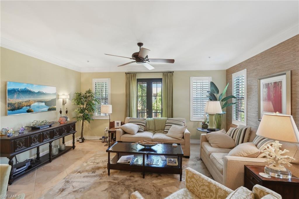 9108 Capistrano Street South, Unit 7401 Naples, FL 34113 - Photo 6 of 44 a living room with furniture and a window
