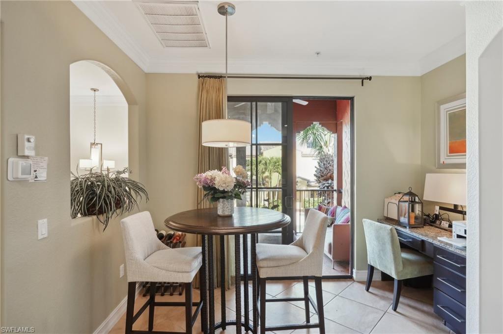 9108 Capistrano Street South, Unit 7401 Naples, FL 34113 - Photo 10 of 44 a view of a dining room with furniture window and outside view