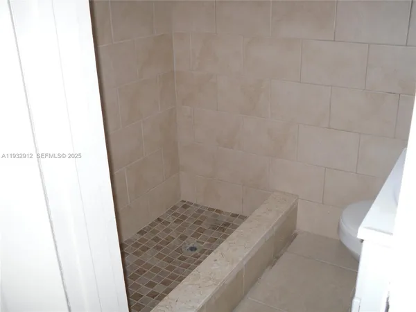 a bathroom with a sink and toilet