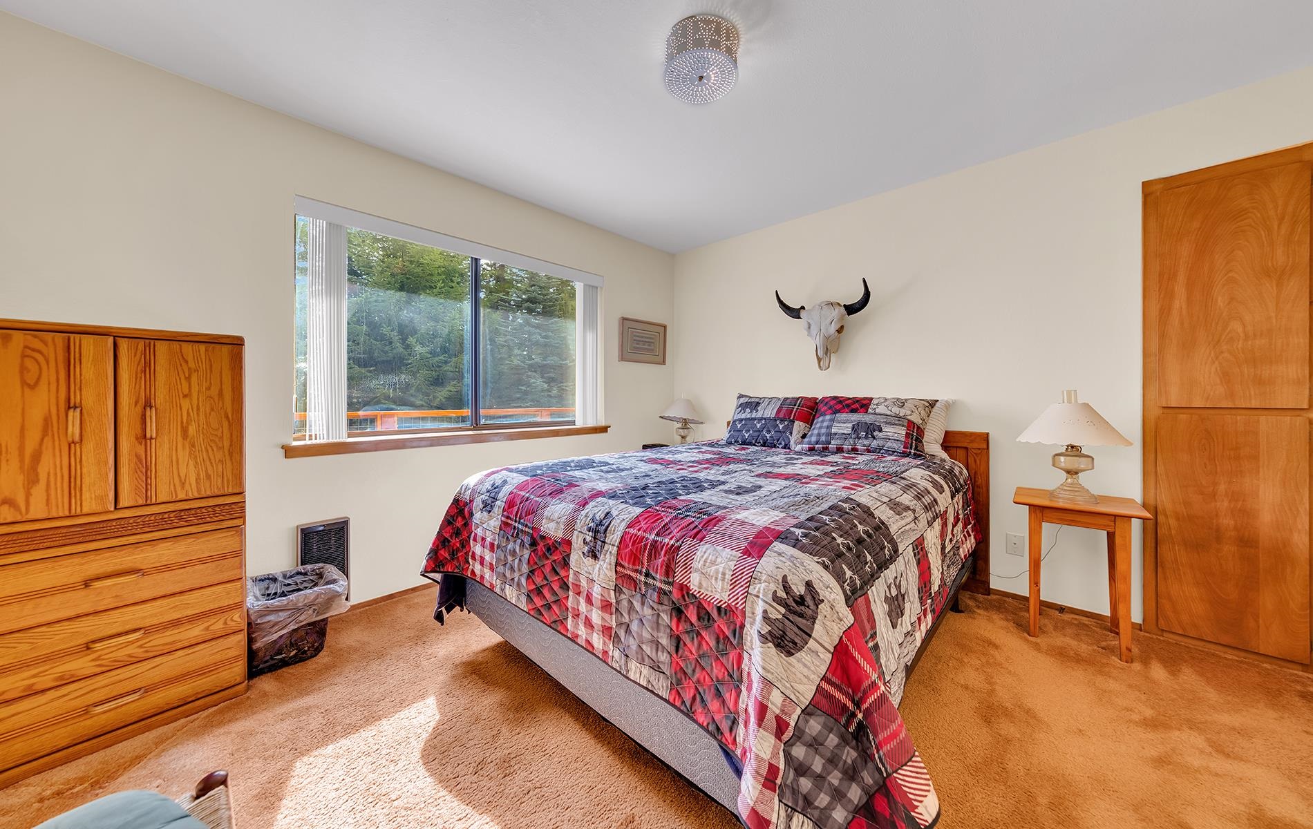 608 East Burnt Cedar Road Lake Almanor, CA 96137 - Photo 18 of 36 a bedroom with a bed and a window