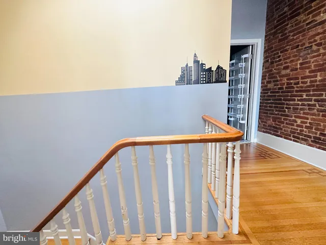 a view of balcony with wooden floor