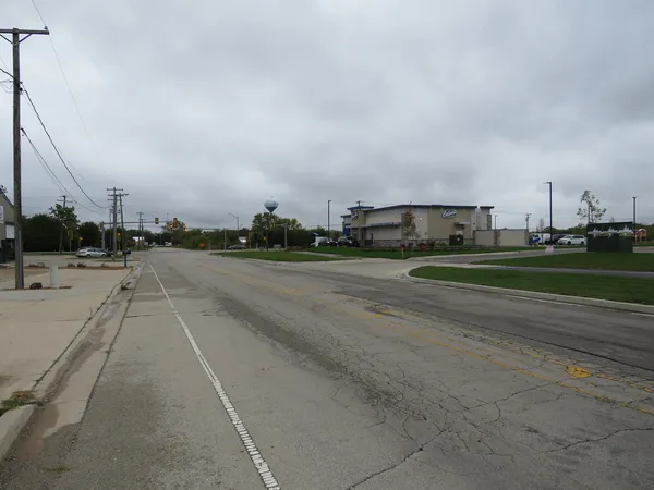 a view of a city street with a building