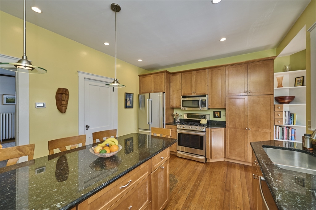 132 Windermere Road Auburndale, MA 02466 - Photo 11 of 38 a kitchen with granite countertop a sink appliances and cabinets