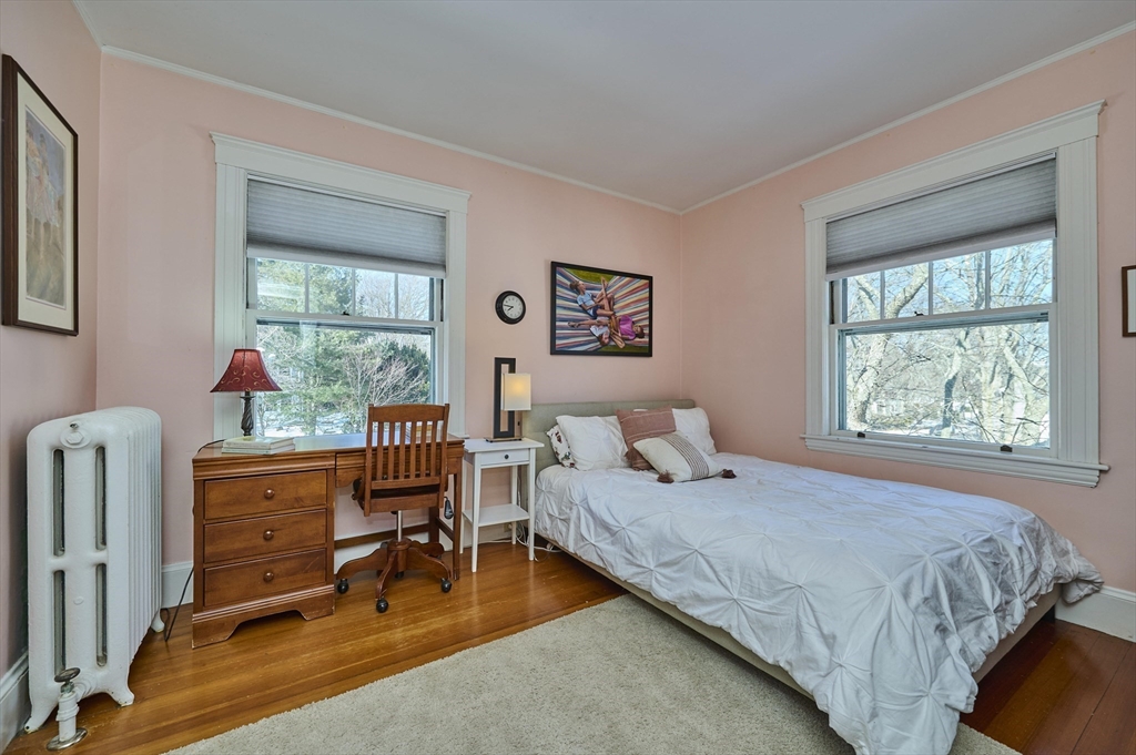 132 Windermere Road Auburndale, MA 02466 - Photo 19 of 38 a bedroom with a bed and wooden floor