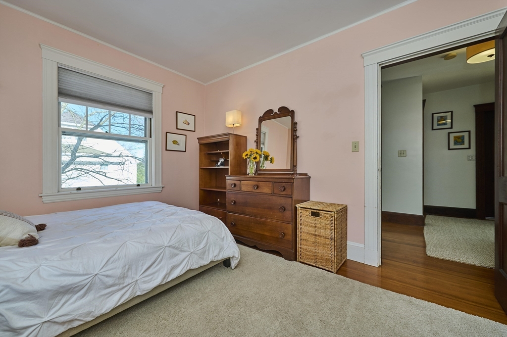 132 Windermere Road Auburndale, MA 02466 - Photo 20 of 38 a bedroom with a bed and wooden floor
